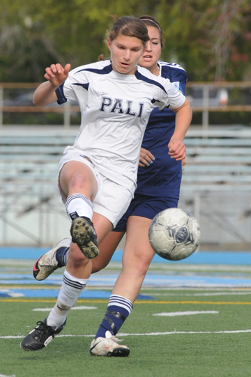 MAKING A RUN: Palisades junior midfielder Melisa Tallis makes a pass and takes off running past a Sylmar defender in Tuesday's 1-0 home win over the Spartans.