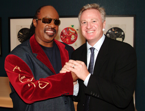 Barnett with internationally known singer Stevie Wonder, one of many acts his OnStage Talent Group has coordinated for corporate events.