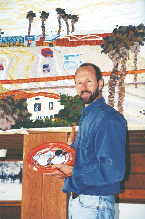Modern California Impressionist artist Dana Torrey, working on his mural at Gladstone's.
