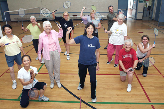 Badminton regulars at the Recreation Center include, front row (left to right): Xiaojun Sun (kneeling), Lois Uttal, Betsy Rosenthal, Barbara Vatcher (kneeling) and Eileen Savage (kneeling). Back row: Marianne Lu, Bertha Lucas, Mary Elsom, Nancy Evans, Patrick Taulere and Patricia Lewin.