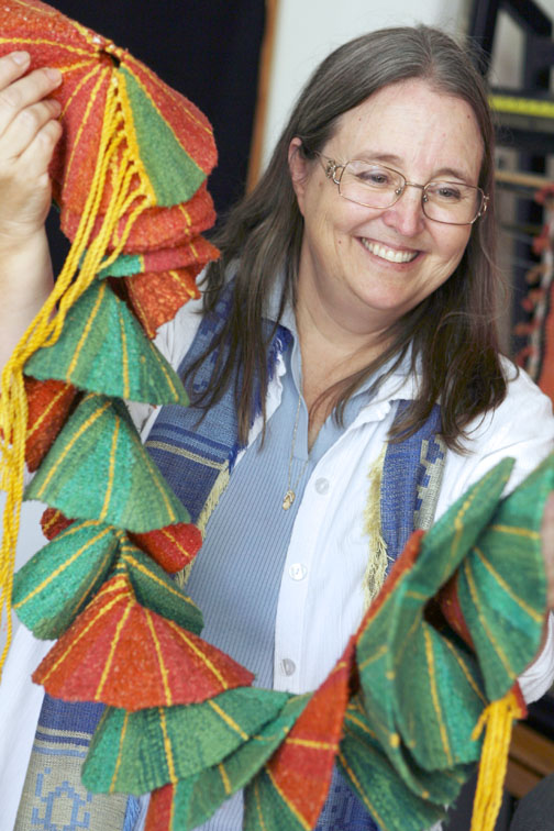 Palisadian Nicki Bair displays her three-dimensional woven sculpture called 