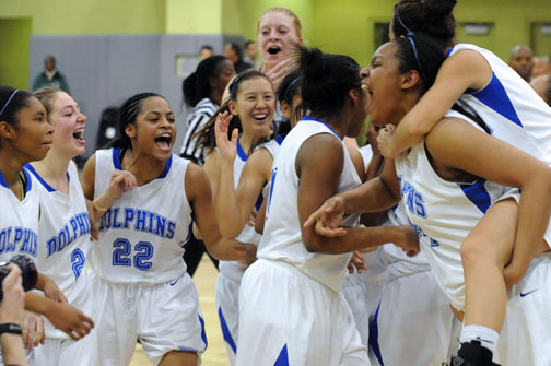 WHAT A RIDE: The Palisades girls basketball team celebrates after winning the Division II City championship, 62-44, over South East at Roybal Learning Center last Friday night.
