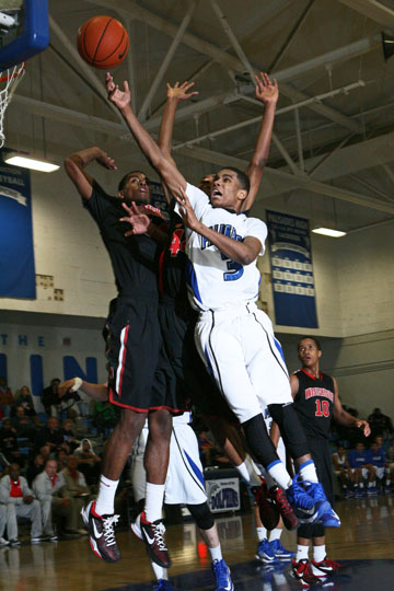 Junior guard Aaron Johnson drives for a layup during a January 14 game against Westchester.	 Rich Schmitt/Staff Photographer