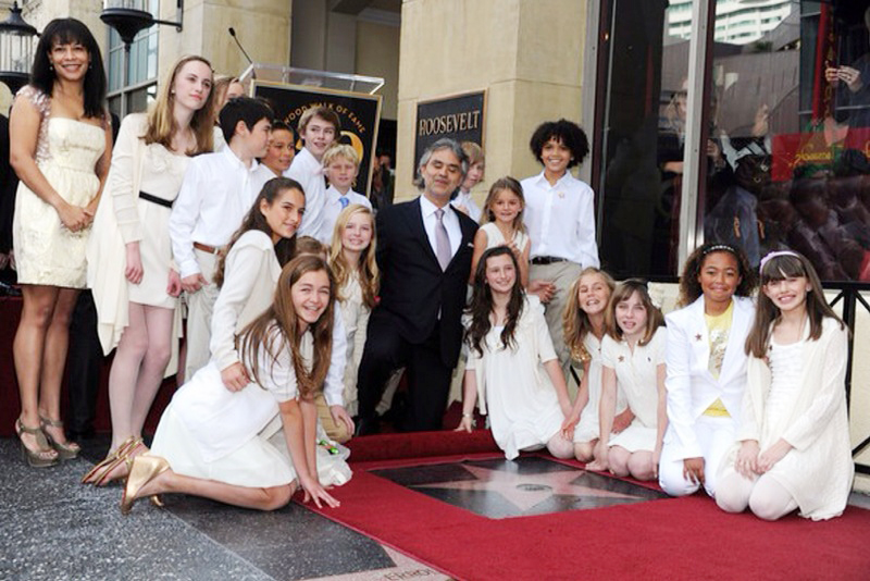 Andrea Bocelli admires his star on Hollywood Boulevard, surrounded by the Adderley School