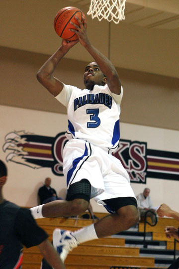 Senior Donovan Johnson goes airborne for a basket during PaliHi's 72-31, opening-round win over Centennial Compton at the Oaks Christian Tournament in Thousand Oaks. Rich Schmitt/Staff Photographer