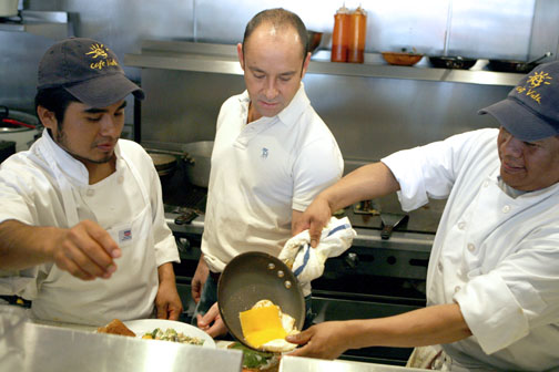 Luis Castaneda (center) in the kitchen at Cafe Vida on Antioch.