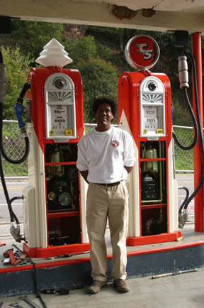 Canyon Service owner Brian Clark with his vintage gas pumps.