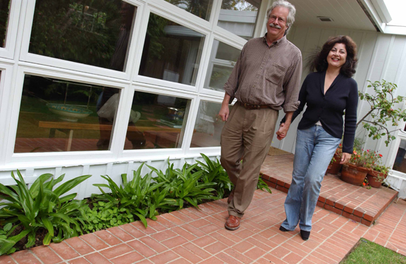 Radliffe Avenue residents Winston Chappell and Catherine Kanner walk out their real front door towards the perceived front door of their home, which opens into a gorgeous courtyard, not into the house. They bought the home in 1990, after living two years in a house on Hampden Place.