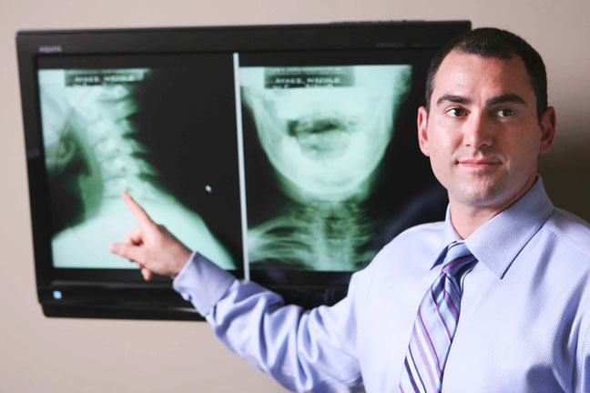 Dr. Luke Cohen displays X-rays in his chiropractic office on Marquez Avenue in Pacific Palisades.
