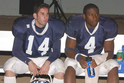 Dylan Cohen (left) and Andre Harris ponder another frustrating loss from the bench.