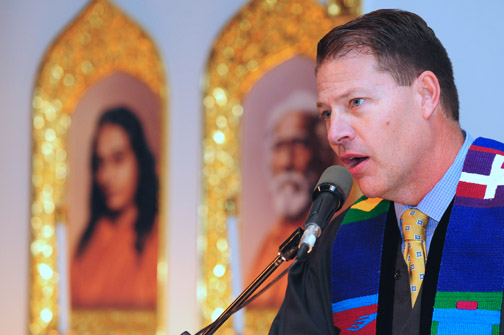 Pacific Palisades Presbyterian Pastor Rev. Daniel Hagmaier reads from the New Testament, Philippians 4:4-9, at Monday night's Interfaith Thanksgiving Service. Rich Schmitt/Staff Photographer