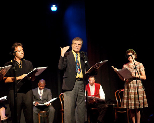 Actor Fred Willard (center) reads from a vintage radio-serial transcript during a 