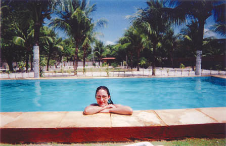 Author Alyson Sena sunbathes in the pool at the country house of Antonio and Eliza Lopes during her January home stay in Fortaleza, on Brazil's northeastern coast in the state of Ceara. Photo: Jon Spack