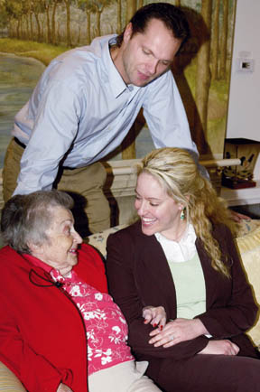 Jill Pizitz-Hochstein and Erik Hochstein, founders of Senior Smiles, visit with a resident at a facility in Santa Monica.