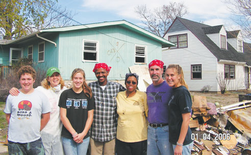 The Sanborn family pose with Harold and Barbara Hamilton in front of their home, which is unsalvageable. From left to right, Ander, Carol, Harold, Barbara, Scott and Jessica.  Photo courtesy of Carol Sanborn