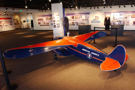 In the main room of the Flight Path Learning Center Museum on Imperial Highway, a miniature antique American Airlines plane anchors the room. Exhibits of travel posters, maps and paintings line the walls.