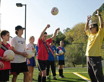 Coach Don Randolph instructs his players to keep both feet on the ground during throw ins. From left are Sam Masius, 12, 