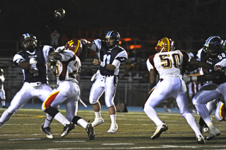 Venice defenders swarm to tackle Palisades tailback Marquise Coleman in the third quarter of last Friday night