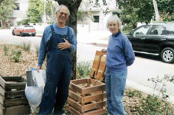 Shirley Haggstrom, incoming president of the Pacific Palisades Historical Society, visits with Dr. Roger Woods and the trash container he designed and built for Founders Oak Island.