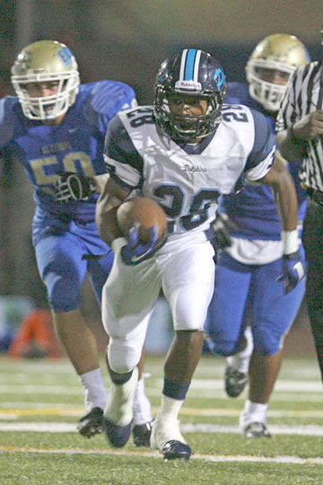 Dolphins running back Arte' Miura races into opposing territory on his punt return in the fourth quarter of Pali's 24-21 loss at El Camino Real last Friday night. Rich Schmitt/Staff Photographer