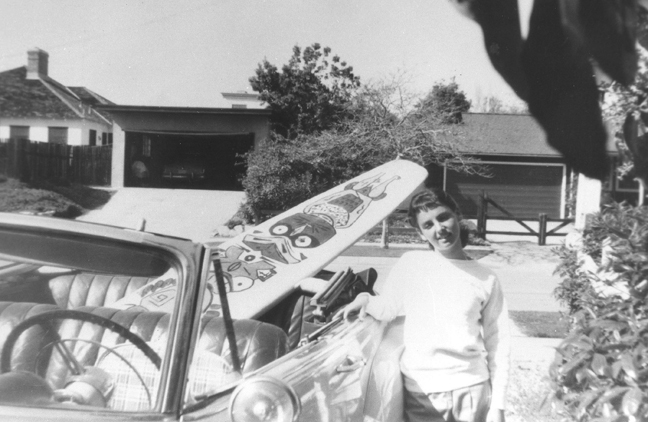 Kathy Kohner gets ready for a day at the Malibu beach in 1956 after loading her 81/2 foot, 22 pound board in the car. Kohner was the inspiration for her father?s book 