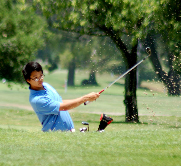 Palisades' Chris Lee hits out of a bunker during last Wednesday's City golf championships in Griffith Park.