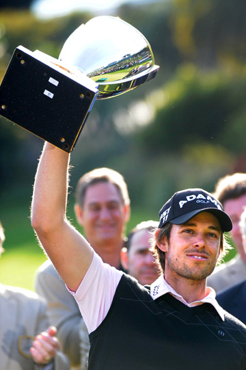 Australian Aaron Baddeley shows off his Northern Trust Open trophy after winning Sunday at Riviera Country Club. He outlasted Fred Couples and Vijay Singh en route to his first Tour win since 2007. Rich Schmitt/Staff Photographer