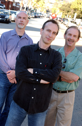 Graphics Editors Tom Hofer, Manfred Hofer and Ed Lowe. The staff of the Post were profiled in this week's issue.