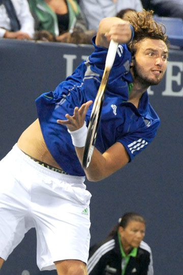 22-year-old Ernests Gulbis of Latvia serves in the first round of the 2011 Farmers Classic. Gulbis defeated American Mardy Fish in Sunday's final to win his second career ATP title. Rich Schmitt/Staff Photographer