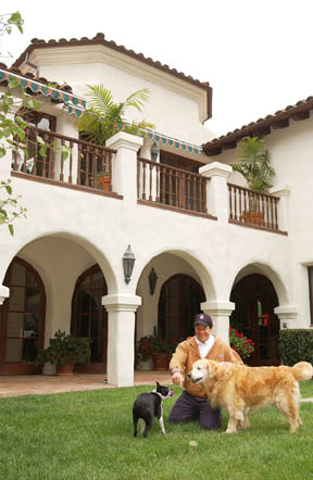 Steve Guttenberg in the back garden of his home in the Highlands, with his golden Lab Bucky and Bucky's friend, Buddy. The honorary mayor has lived in the Mediterranean-style house since 1989.