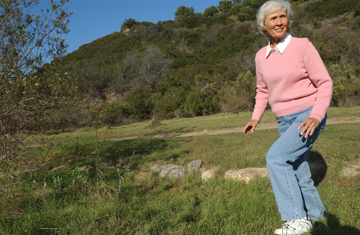 Shirley Haggstrom in the streambed at Los Liones Gateway Park, which she hopes will one day be restored to its natural free-flowing state every winter. Rich Schmitt/Staff Photographer