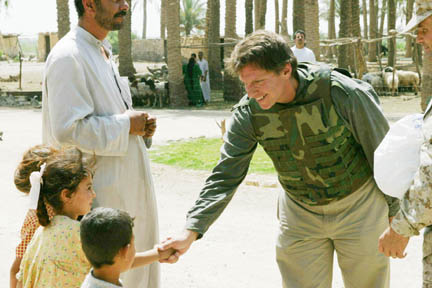 Palisadian Jim Hake greets Iraqi children and distributes school supplies, soccer balls and Frisbees during his recent trip to the Ramadi-Fallujah area.