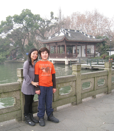 Evan Epstein, the Palisades First Baby of 2000, visits Hangzhou, a beautiful city near Shanghai, with his mother, Tiffany Hu.