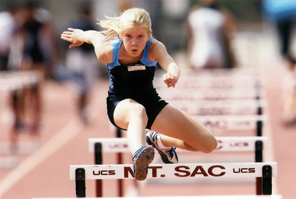 Kendall Gustafson clears a hurdle on her way to winning the pentathlon at the USA Outdoor Track & Field Championships. Photo: Greg Smotherman