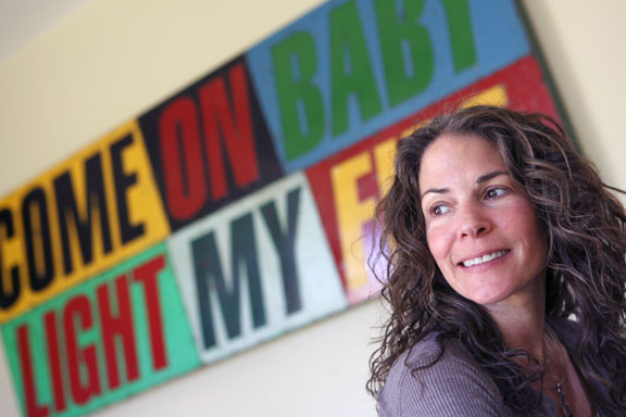 Pacific Palisades resident Jacquie Israel at home with her art, including David Buckingham's 