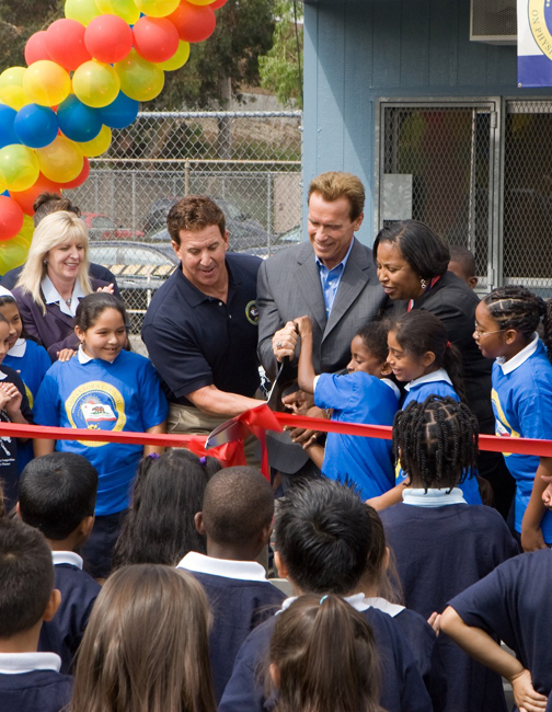 Palisadian Jake Steinfeld (left) and California Governor Arnold Schwarzenegger cut the ribbon to officially open a brand new fitness center at Marvin Elementary School in Los Angeles. Photo: Duncan McIntosh / Office of Gov. Schwarzenegger