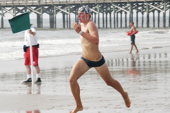 Ben Lewenstein runs to a first-place finish in the Iron Guard event at Junior Lifeguard Nationals held in South Carolina. Photo: Karen Kornreich
