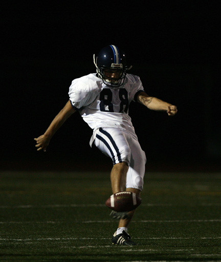Palisades kicker Joe Berman punts the ball in the first quarter of the Dolphins' 51-7 loss to Fairfax.