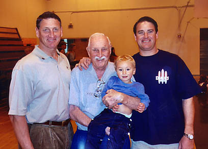 Robert Francis Klein with his son, Bobby, grandson Jimmy and great-grandson Dillon, at the Palisades High gym on February 26, just two days before he passed away.