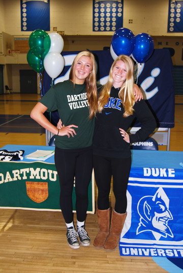 PaliHi seniors Molly Kornfeind (left) and Kendall Gustafson represent their new colleges at National Signing Day at Palisades High last Wednesday.