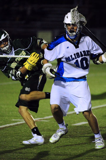 Junior captain and defenseman Chris Groel takes on an opponent during last week's 14-8 win over Mira Costa.  Rich Schmitt/Staff Photographer