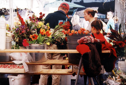A flower stand at the Sunday Farmers' Market on Swarthmore. 
