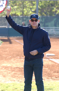 Actor Tom Hanks shows off the ball he's about to throw to his son Truman to officially begin the Palisades Pony Baseball Association's season.