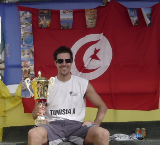 Curt Toppel with the Dukhan Water Works Volleyball championship trophy he won with Team Tunisia near Doha.