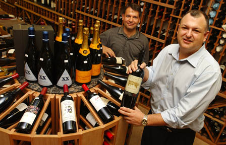 Palisadian Scott Levy (right), owner of Moe's Fine Wines in Brentwood, with his neighbor and architect friend, Ali Kia, who designed the store on San Vicente.