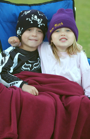 Luke and Sawyer Badt snuggled up in the untypical August weather at the Field of Dreams to enjoy 
