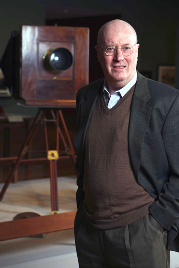 Palisadian Weston Naef, senior curator of the Department of Photographs at the J. Paul Getty Museum, has spent much of his professional career studying the work of Carleton Watkins. Behind him stands Watkins' mammoth-plate camera, which produced the first photographs of Yosemite. Photo by Rich Schmitt/Staff Photographer