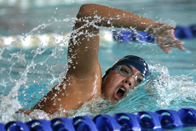 Justin Nam completes his leg of the 400 freestyle relay, which Pali won.