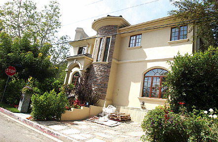The home of Mehr and Vickey Beglari, located on the corner of Greentree and Brooktree in Rustic Canyon, is 14 feet closer to the street (Greentree) than permitted by the governing sections of the Los Angeles Municipal Code.