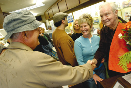 John Harrington, who founded Harrington's Camera at the corner of Sunset and Antioch in 1958, and his daughter Cathy greet a visitor at last Saturday's 
